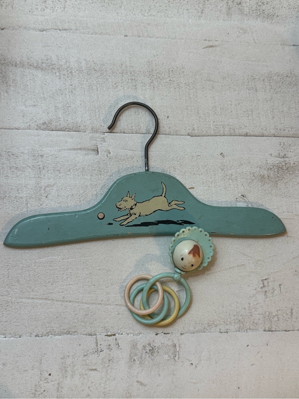 vintage 1930s to 1940s Art Deco wooden child's clothes hanger and baby rattle